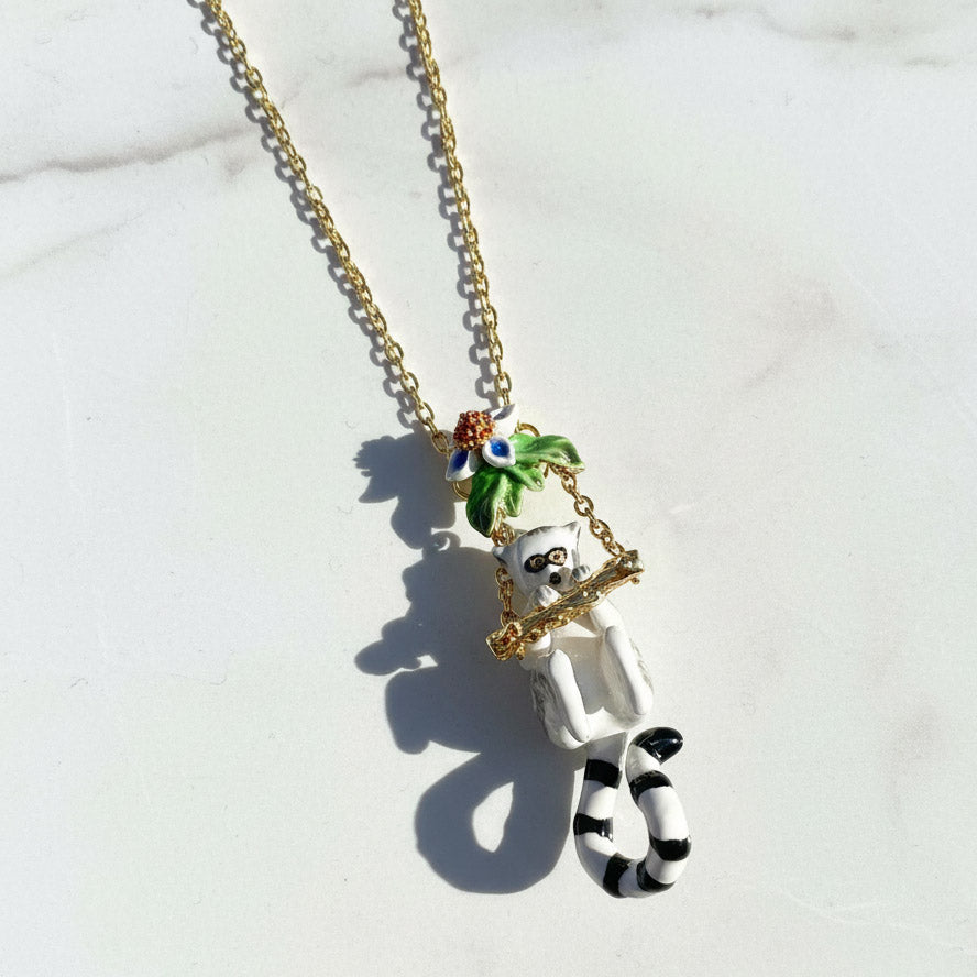 Necklace with a lemur pendant on a light background
