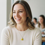 Woman smiling with a blurred classroom background
