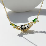 Necklace with panda and floral design on a white background