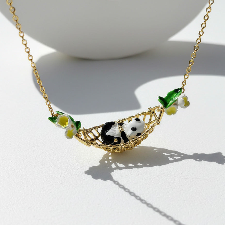 Necklace with panda and floral design on a white background