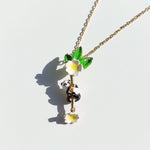 Necklace with panda and flower pendant on a white background