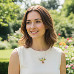 Woman with a necklace standing in a garden