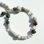 Colorful beaded bracelet on a white background
