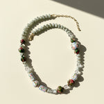 Necklace with floral beads on a beige background