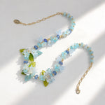 Necklace with floral and bead design on a light background