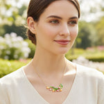 Woman wearing a colorful necklace with a blurred garden background