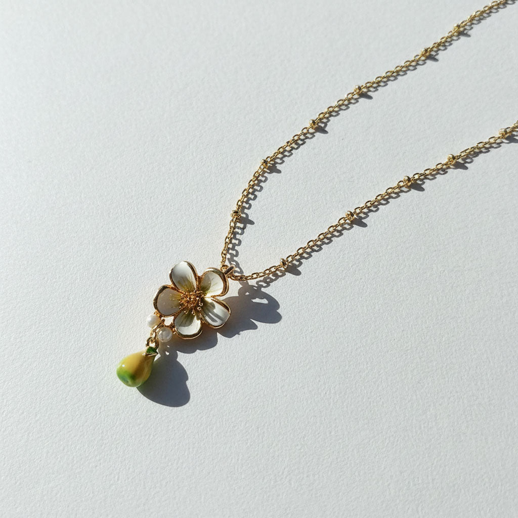 Necklace with a floral pendant on a light gray background