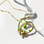 Gold plated pear blossom pendant with painted pear fruit inside circle