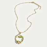 Gold plated necklace with circular pear blossom enamel pendant on chain
