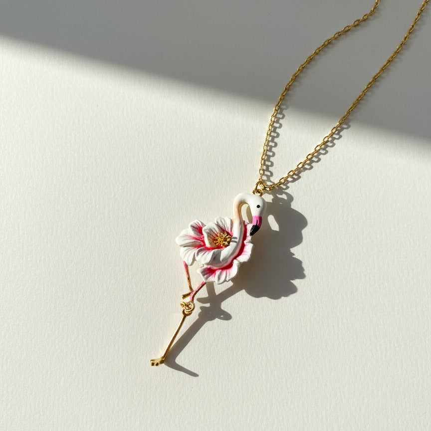 Necklace with a flamingo pendant on a light background