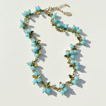 Aqua blue berry garden necklace with semi-precious stone beads and enamel leaf details on gold-plated brass