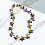 Plum berry garden necklace with purple semi-precious stones and green enamel leaves, handcrafted design