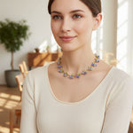 Woman wearing a floral necklace in a bright indoor setting