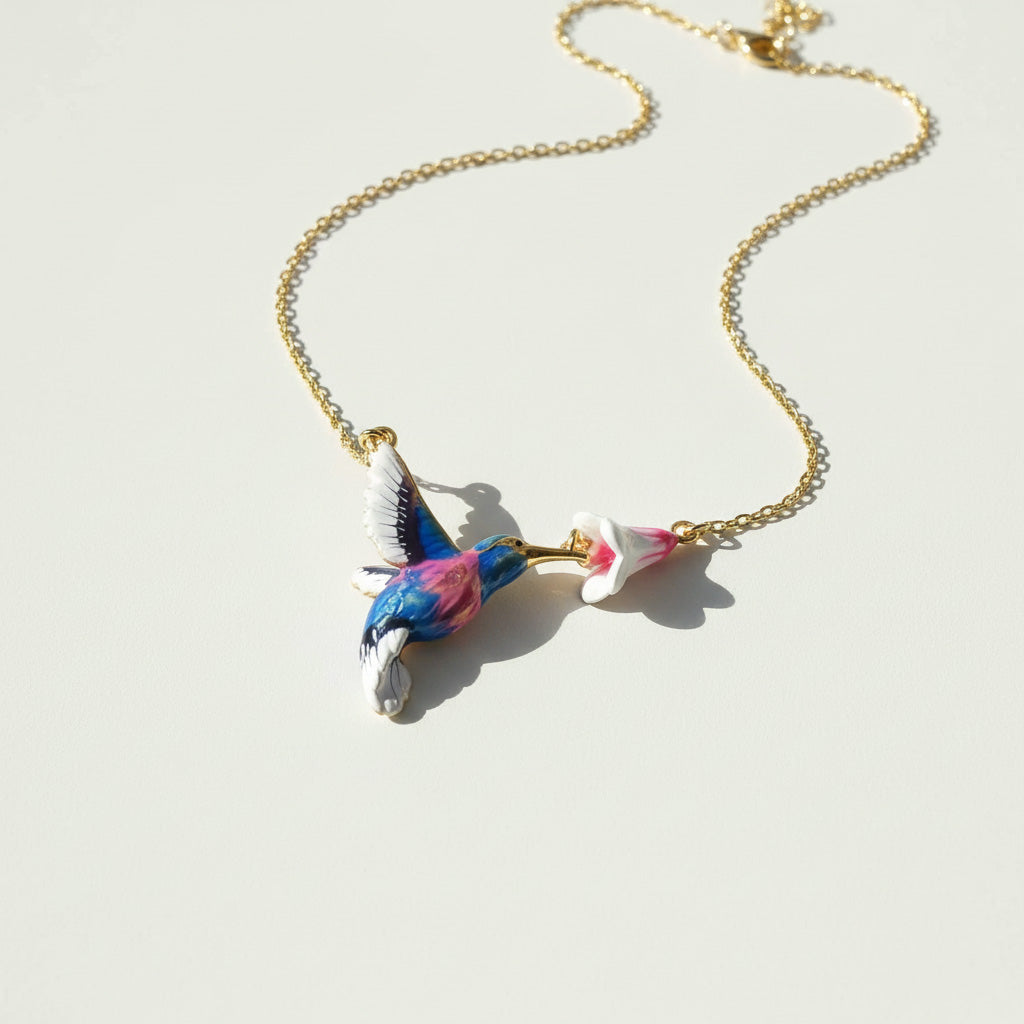 Necklace with a colorful bird pendant on a light background