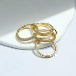Set of gold rings on a white surface