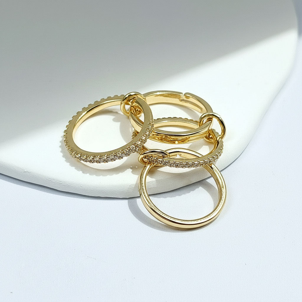 Set of gold rings on a white surface