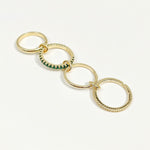 Gold keychain with interlocking rings on a white background