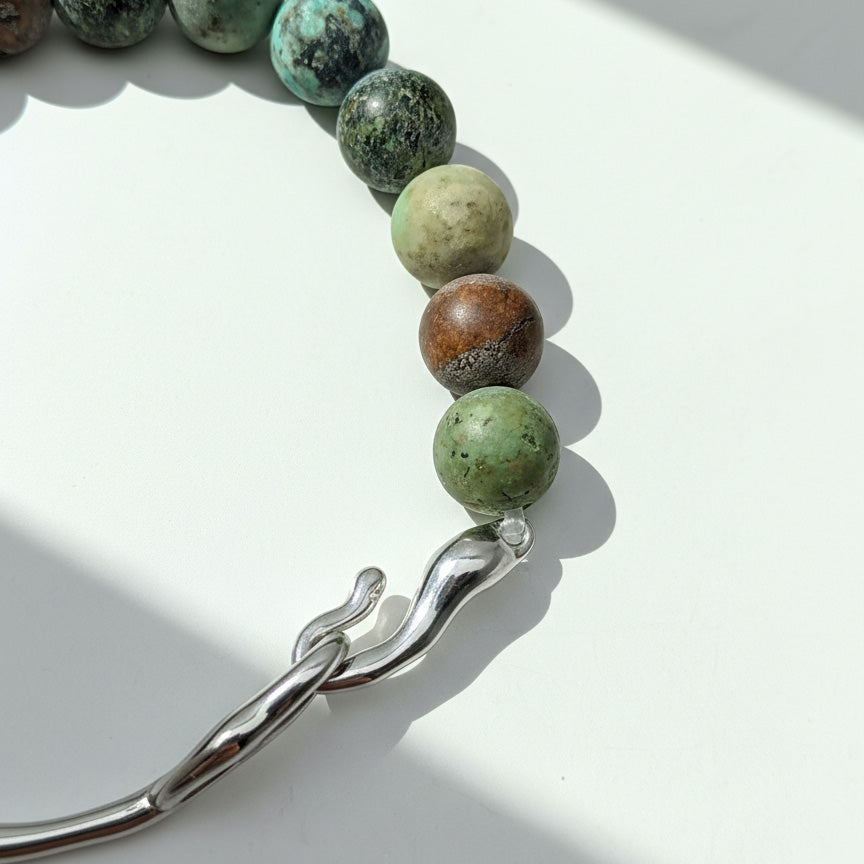 Close-up of 9mm matte African Turquoise Jasper beads and polished stainless steel hook