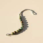 Minimal African Turquoise Jasper bracelet with open stainless steel hook in natural light