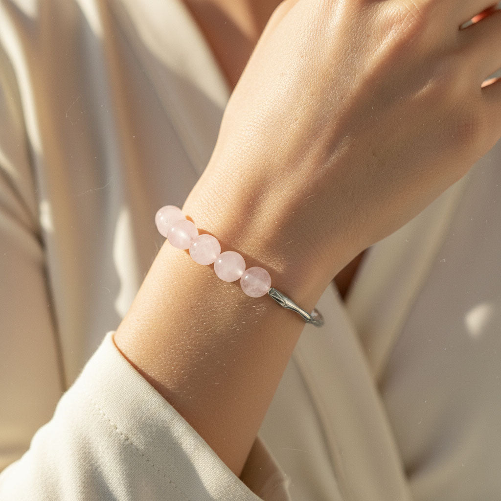 Rose Quartz bracelet worn on wrist in natural golden sunlight