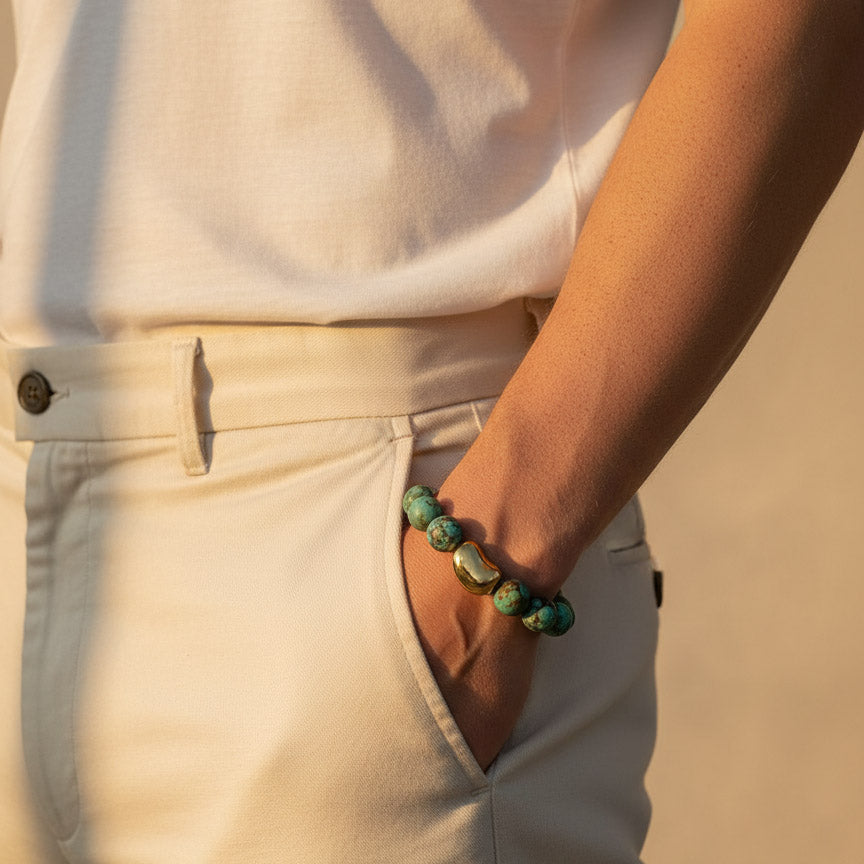 African Turquoise Jasper bracelet worn on wrist with gold stainless steel accent bead