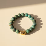 10mm matte African Turquoise gemstone bracelet on cream background