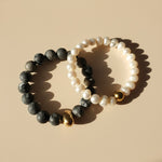 Natural Picasso Jasper and freshwater pearl bracelets in warm sunlight