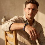 Natural sodalite bracelet with lapis lazuli bead worn on male wrist