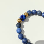 Close up of sodalite and lapis lazuli beads with gold stainless steel bead