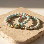 Shoushan stone bracelet set styled on natural beige stone surface