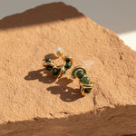Sculptural stud earrings with Indian agate beads on terracotta stone